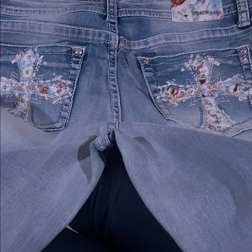 Grace in LA High Rise Light Blue Jeans with Embellished Pockets